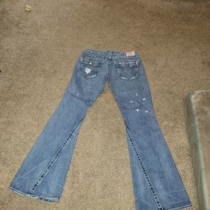 Distressed designer jeans